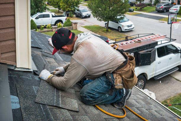 Professional Roofing technician working in Levittown, NY